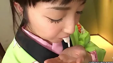 Asian bitch in a kimono sucking on his erect prick