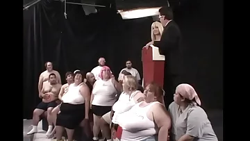 Two dozens of lard-asses suck, lick and pulverize each other during The Worlds First 300 Lb Gang Bang, organized by ingenious beauty Kat Kleevage