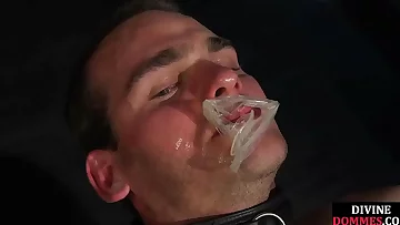 BDSM mistress dominates sub with lash and cum