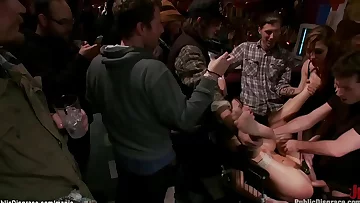 Dark haired gets rectal gang bang in public