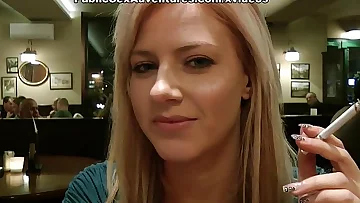 Blonde girl demonstrating tits in the cafe